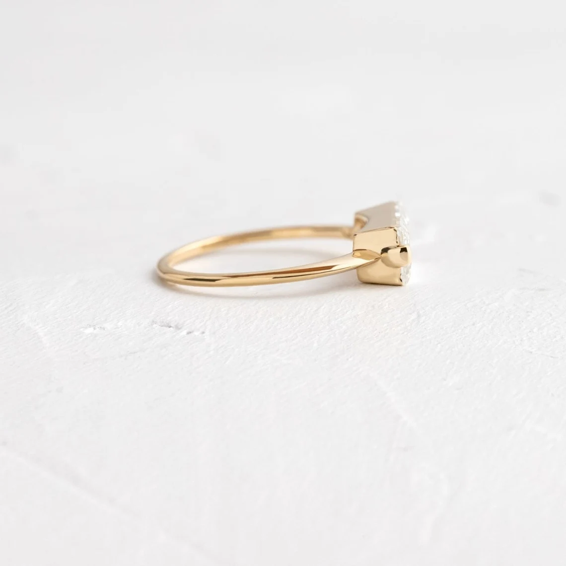 Streamlined silver setting holding a baguette moissanite with glassy clarity A piece that feels polished, structured, and effortlessly elevated Designed for contemporary elegance with a sharp edge - Image 4