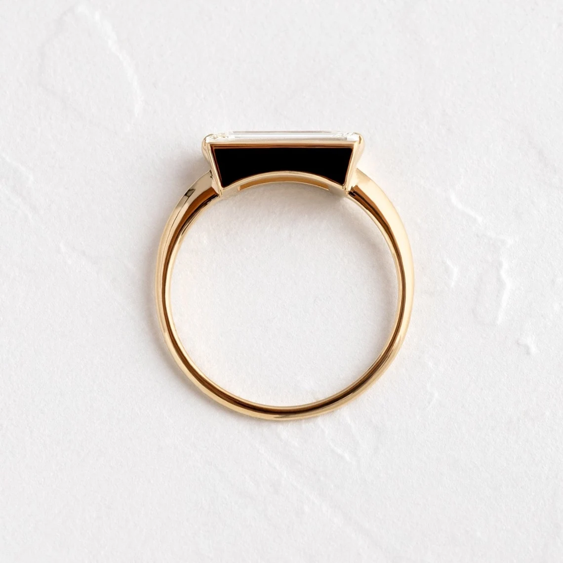 Streamlined silver setting holding a baguette moissanite with glassy clarity A piece that feels polished, structured, and effortlessly elevated Designed for contemporary elegance with a sharp edge - Image 2