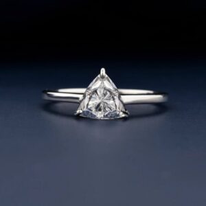 Fine silver setting featuring a triangular moissanite with crisp brilliance A piece that embodies precision luxe with a sleek, refined finish Designed for those who favor sharp lines and pure elegance