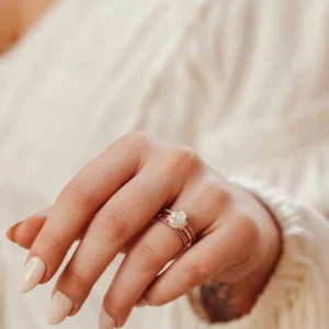 Duo band silver ring showcasing a moissanite with surrounding brilliance A look that blends structure with a rich, multi band aesthetic Perfect for a statement style with refined sparkle