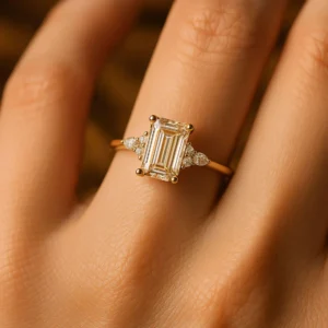 Silver band featuring a step cut moissanite with soft pear detailing on the sides A ring that blends structure with graceful contrast Perfect for a luxe composition with artistic depth