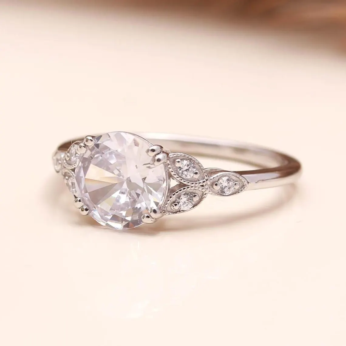 Vintage Style Oval Cut Moissanite Engagement Ring in Silver Elegant Milgrain Leaf Design with Side Accent Stones, Antique Inspired Floral Band, Delicate Yet Eye Catching Bridal Jewelry for Women - Image 7