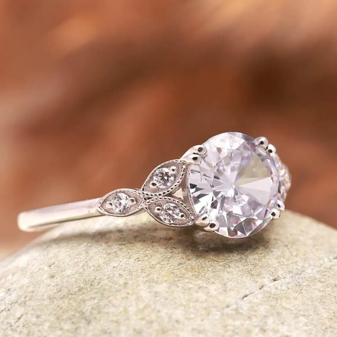 Vintage Style Oval Cut Moissanite Engagement Ring in Silver Elegant Milgrain Leaf Design with Side Accent Stones, Antique Inspired Floral Band, Delicate Yet Eye Catching Bridal Jewelry for Women - Image 4
