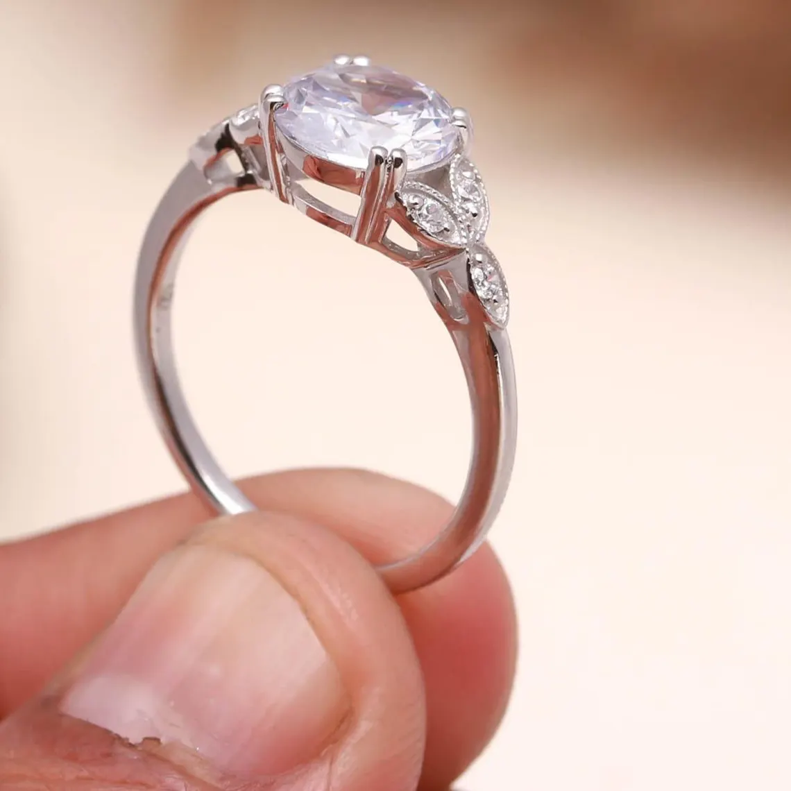 Vintage Style Oval Cut Moissanite Engagement Ring in Silver Elegant Milgrain Leaf Design with Side Accent Stones, Antique Inspired Floral Band, Delicate Yet Eye Catching Bridal Jewelry for Women - Image 3