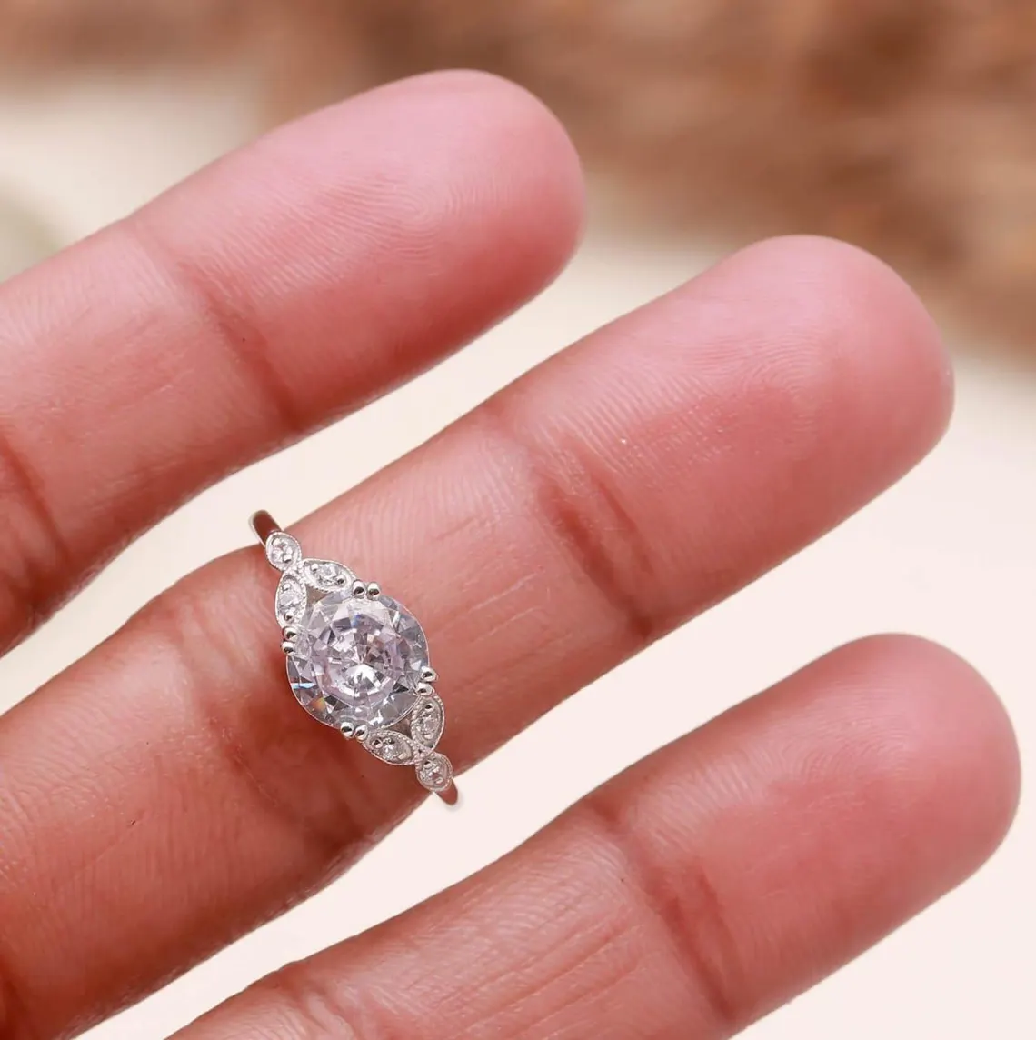 Vintage Style Oval Cut Moissanite Engagement Ring in Silver Elegant Milgrain Leaf Design with Side Accent Stones, Antique Inspired Floral Band, Delicate Yet Eye Catching Bridal Jewelry for Women - Image 2