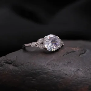 Vintage Style Oval Cut Moissanite Engagement Ring in Silver Elegant Milgrain Leaf Design with Side Accent Stones, Antique Inspired Floral Band, Delicate Yet Eye Catching Bridal Jewelry for Women