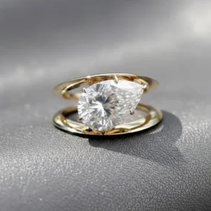open bypass silver ring featuring dual core moissanite in a floating set design A look that captures contrast pairing with a seamless infinity flow Made for a bold, modern statement with fluid structure