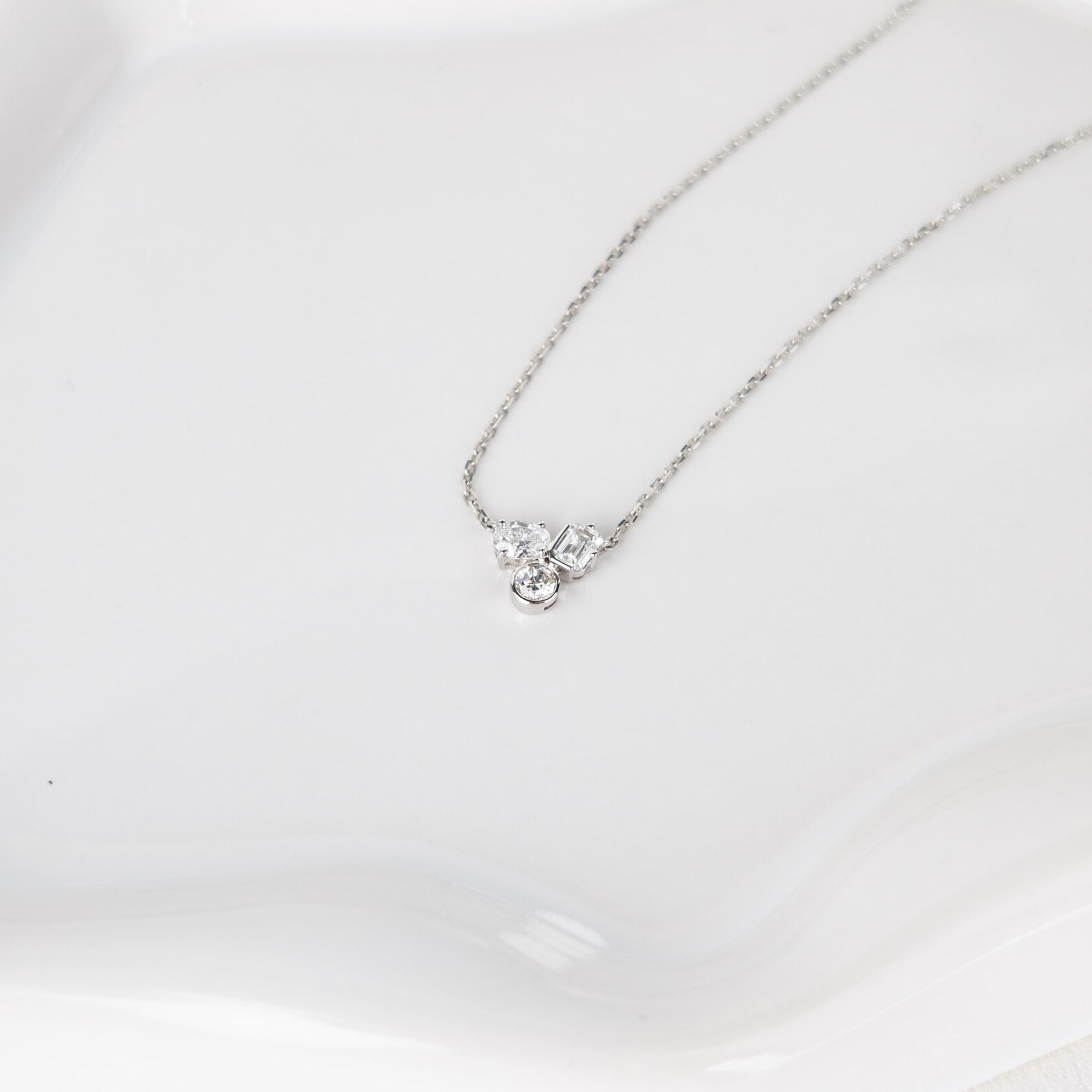 Necklace in 14K Gold with Floating Multi Stone Design and Soft Sparkle Flow Dainty Minimal Pendant Jewelry for Everyday Wear with a Modern Graceful Luxury Touch Elegant Curved Diamond - Image 2