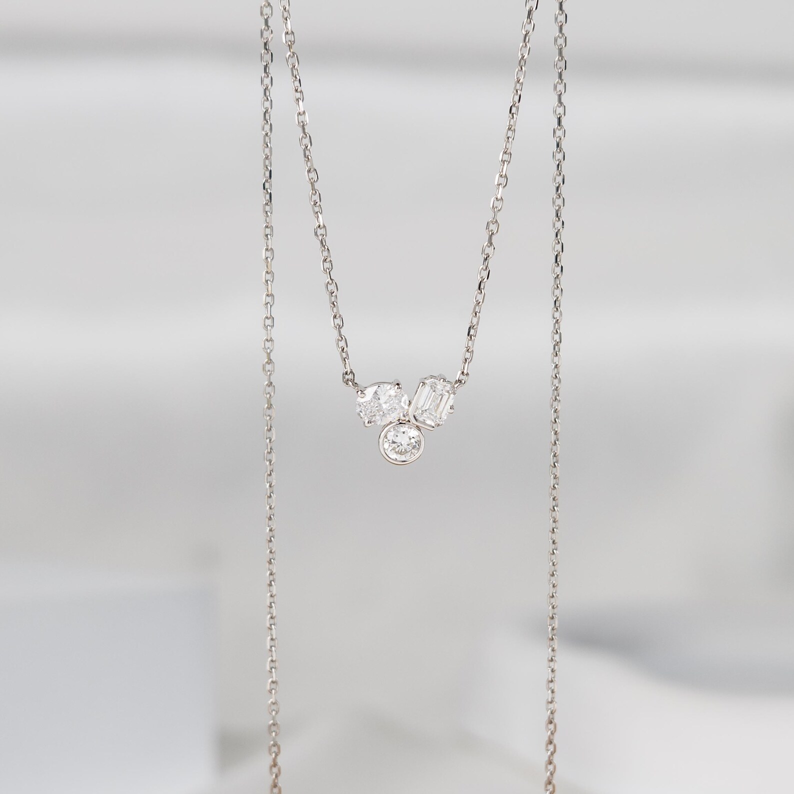 Necklace in 14K Gold with Floating Multi Stone Design and Soft Sparkle Flow Dainty Minimal Pendant Jewelry for Everyday Wear with a Modern Graceful Luxury Touch Elegant Curved Diamond