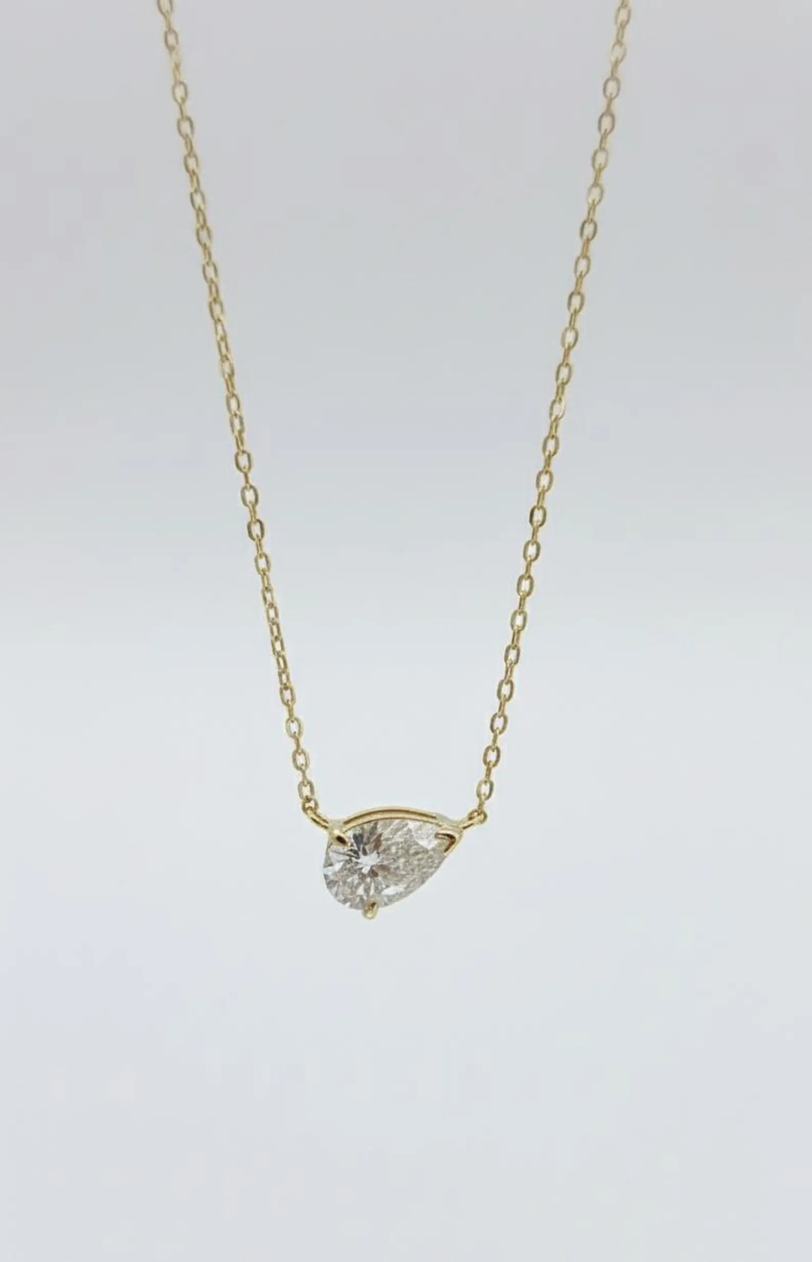 Asymmetrical Pear Diamond Pendant Necklace Designed in 14k Yellow Gold Sleek Sideways Setting Fine Jewelry Gift Modern Teardrop Diamond Necklace Lightweight Minimal Chain Elegant Sophisticated Jewelry for Women - Image 5
