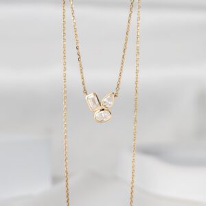 Unique Artistic Layout and Modern Multi Shape Diamond Pendant Necklace in 14K Gold Featuring Emerald Pear and Oval Stones Dainty Statement Jewelry Piece with Geometric Elegance Designed