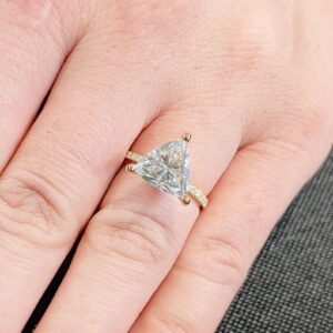 Forever Shine Trillion Cut Diamond Engagement Ring with a Brilliant Faceted Center Stone Set in a Classic Three Prong Setting with a Delicate Pavé Diamond Band in Polished 14K Yellow Gold