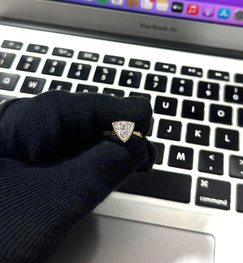 Trillion cut diamond solitaire engagement ring in a sleek bezel setting, crafted in 14K yellow gold Classic yet modern design with clean geometric lines, refined sparkle, and a bold sophisticated look - Image 3