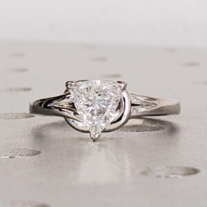 Stunning Trillion Cut Diamond 14k White Gold Setting Engagement Ring with a Brilliant Sparkling Center Stone Set in an Elegant Twist Style Band with Sleek Tapered Shoulders